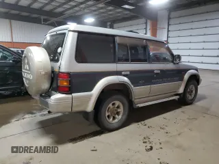 1995 Mitsubishi Montero z VIN 2BGF0126264046653, wystawiony jako Copart lot #81135584 z przebiegiem 254 106 mil mil oraz Czysty tytuł • Clean title. Historia ofert i sprzedaży dostępna na DreamBid. Obrazek 3.