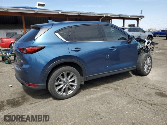 2021 Mazda CX-5 Grand Touring Reserve with VIN JM3KFBAY8M0384498, listed as a Copart auction lot 52013445 with 20,469 mi miles and Salvage Title. Bid and sale history available at carsss.com. Image 3.
