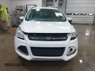 2014 Ford Escape SE with VIN 1FMCU9G99EUC15477, listed as a IAAI auction lot 42147162 with 98,886 mi miles and . Bid and sale history available at DreamBid. Image 12.