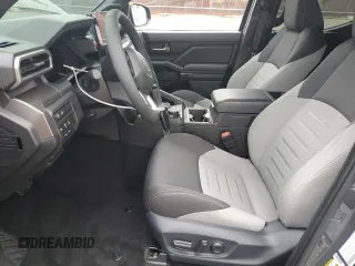 2025 Toyota Tacoma SR with VIN 3TMLB5JN4SM104263, listed as a Copart auction lot 54402775 with 1,010 mi miles and Salvage Title. Bid and sale history available at DreamBid. Image 7.