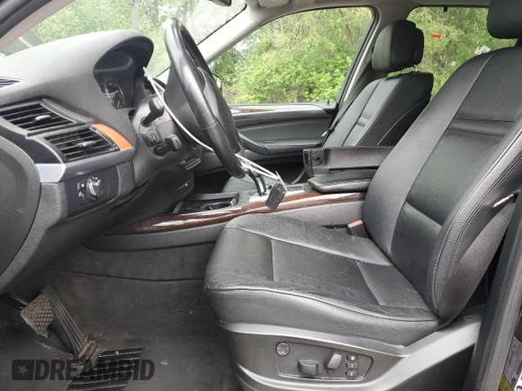 2012 BMW X5 35d with VIN 5UXZW0C54CL671377, listed as a Copart auction lot 60936395 with 105,903 mi miles and Salvage title. Bid and sale history available at DreamBid. Image 7.
