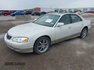 2001 Mazda Millenia S z VIN JM1TA222811710618, wystawiony jako IAAI lot #42292915 z przebiegiem 69 444 mil mil oraz . Historia ofert i sprzedaży dostępna na DreamBid. Obrazek 2.