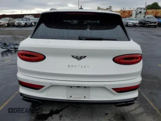 2021 Bentley Bentayga V8 z VIN SJAAM2ZV6MC035957, wystawiony jako Copart lot #76741673 z przebiegiem 14 683 mil mil oraz . Historia ofert i sprzedaży dostępna na DreamBid. Obrazek 6.