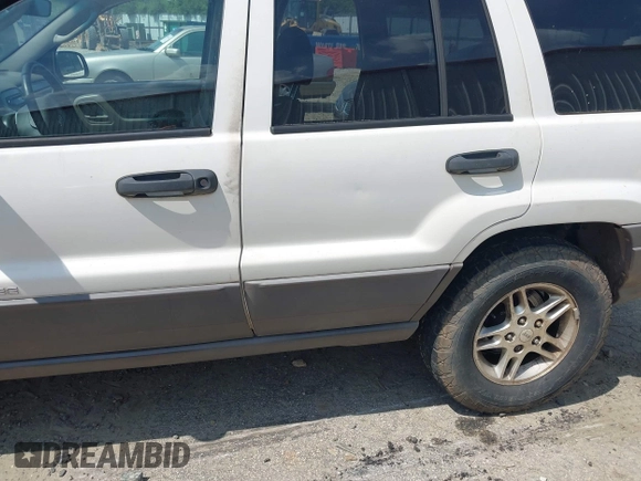 2003 Jeep Grand Cherokee Laredo z VIN 1J4GX48S33C519404, wystawiony jako IAAI lot #42164364 z przebiegiem 174 627 mil mil oraz . Historia ofert i sprzedaży dostępna na DreamBid. Obrazek 6.