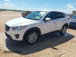 2016 Mazda CX-5 Touring z VIN JM3KE2CY0G0840918, wystawiony jako IAAI lot #42205529 z przebiegiem 74 515 mil mil oraz . Historia ofert i sprzedaży dostępna na DreamBid. Obrazek 2.