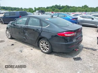 2020 Ford Fusion SE with VIN 3FA6P0LU5LR142665, listed as a IAAI auction lot 42415611 with 101,686 mi miles and . Bid and sale history available at DreamBid. Image 3.