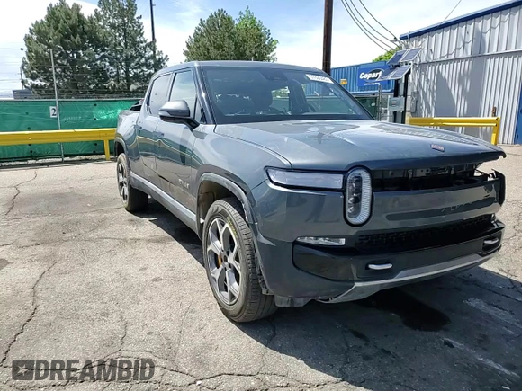 2023 Rivian R1T Adventure z VIN 7FCTGAAA4PN021950, wystawiony jako Copart lot #57800485 z przebiegiem 2 480 mil mil oraz Szkoda całkowita • Salvage title. Historia ofert i sprzedaży dostępna na DreamBid. Obrazek 14.