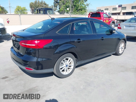 2015 Ford Focus SE with VIN 1FADP3F23FL313614, listed as a IAAI auction lot 42153320 with 121,346 mi miles. Bid and sale history available at carsss.com. Image 4.