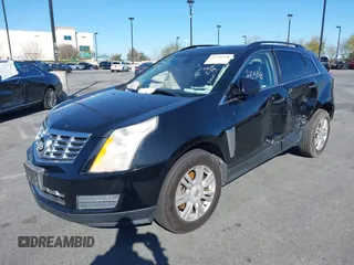 2015 Cadillac SRX z VIN 3GYFNAE32FS543933, wystawiony jako IAAI lot #41578338 z przebiegiem 150 937 mil mil oraz . Historia ofert i sprzedaży dostępna na DreamBid. Obrazek 2.