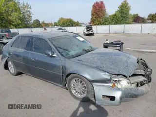 2004 Cadillac DeVille DHS z VIN 1G6KE57Y74U119605, wystawiony jako IAAI lot #40555057 z przebiegiem Nie podano mil oraz . Historia ofert i sprzedaży dostępna na DreamBid. Obrazek 1.