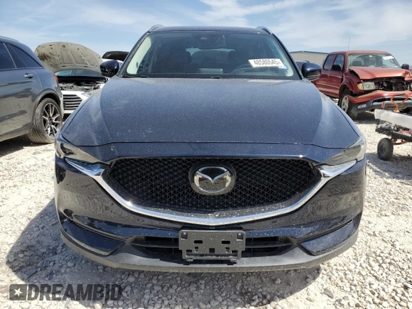 2018 Mazda CX-5 Grand Touring with VIN JM3KFBDM8J0474819, listed as a Copart auction lot 48580545 with 76,917 mi miles and Salvage Title. Bid and sale history available at DreamBid. Image 5.