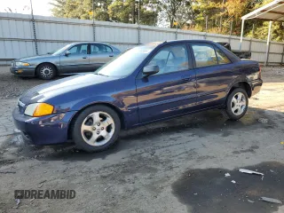 2000 Mazda Protege ES with VIN JM1BJ2217Y0224322, listed as a Copart auction lot 78392694 with 134,715 mi miles and Salvage Title. Bid and sale history available at DreamBid. Image 1.