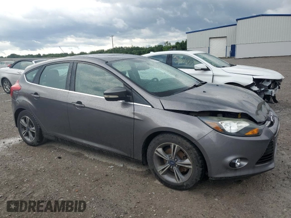 2014 Ford Focus Titanium with VIN 1FADP3N20EL329415, listed as a Copart auction lot 60881115 with 97,382 mi miles and Salvage title. Bid and sale history available at DreamBid. Image 4.