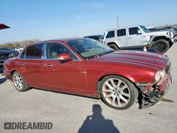 2008 Jaguar XJ with VIN SAJWA79B58SH20211, listed as a Copart auction lot 46951055 with 144,655 mi miles and Salvage Title. Bid and sale history available at carsss.com. Image 4.