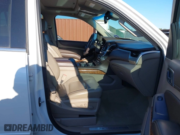 2016 Chevrolet Tahoe LTZ with VIN 1GNSKCKC0GR203348, listed as a IAAI auction lot 42220438 with 108,657 mi miles and . Bid and sale history available at DreamBid. Image 5.