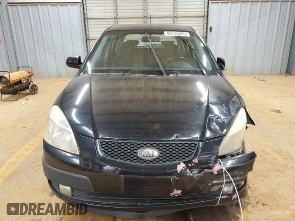 2009 Kia Rio LX with VIN KNADE243896580883, listed as a Copart auction lot 43735505 with 135,726 mi miles and Salvage Title. Bid and sale history available at carsss.com. Image 5.