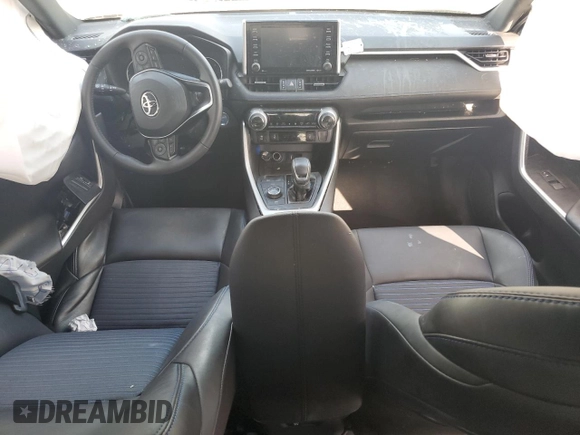 2021 Toyota RAV4 Hybrid XSE with VIN 2T3E6RFV1MW028094, listed as a Copart auction lot 52596615 with 68,497 mi miles and Salvage title. Bid and sale history available at DreamBid. Image 8.
