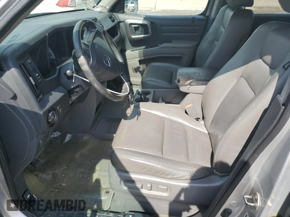 2014 Honda Ridgeline RTL with VIN 5FPYK1F58EB012869, listed as a Copart auction lot 51854995 with 318,950 mi miles and Salvage title. Bid and sale history available at DreamBid. Image 7.