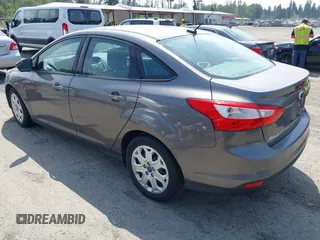 2012 Ford Focus SE with VIN 1FAHP3F25CL260962, listed as a IAAI auction lot 42588485 with 143,679 mi miles and . Bid and sale history available at DreamBid. Image 3.