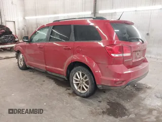 2014 Dodge Journey SXT with VIN 3C4PDCBG2ET188822, listed as a IAAI auction lot 41219215 with 174,053 mi miles. Bid and sale history available at carsss.com. Image 3.