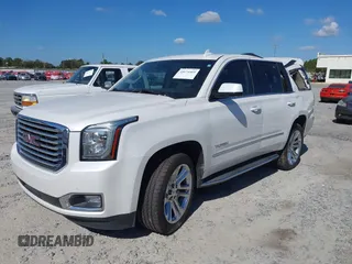 2019 GMC Yukon SLT with VIN 1GKS1BKC9KR332014, listed as a IAAI auction lot 40674460 with 76,545 mi miles. Bid and sale history available at carsss.com. Image 2.