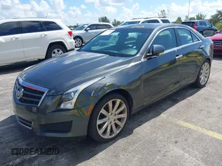 2014 Cadillac ATS Luxury RWD z VIN 1G6AB5RAXE0142079, wystawiony jako IAAI lot #42517963 z przebiegiem 140 118 mil mil oraz . Historia ofert i sprzedaży dostępna na DreamBid. Obrazek 2.