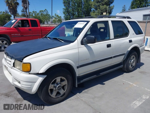 1999 Isuzu Rodeo S z VIN 4S2CM58WXX4347611, wystawiony jako IAAI lot #42351641 z przebiegiem 256 007 mil mil oraz . Historia ofert i sprzedaży dostępna na DreamBid. Obrazek 2.