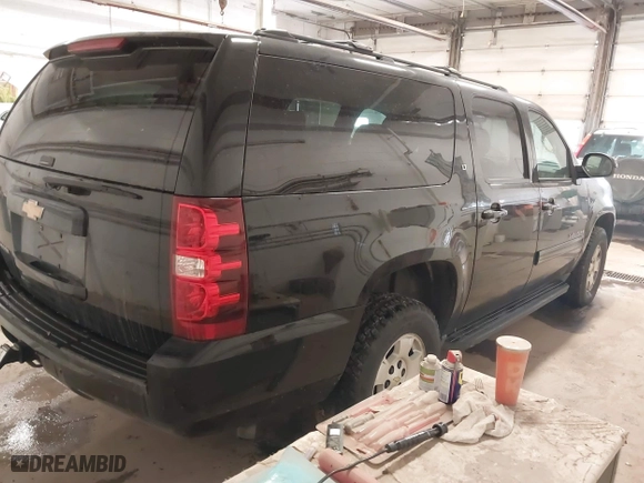 2013 Chevrolet Suburban LT with VIN 1GNSKJE75DR167705, listed as a IAAI auction lot 41521409 with 228,411 mi miles. Bid and sale history available at carsss.com. Image 4.