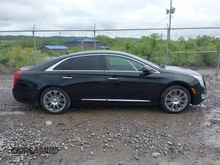 2014 Cadillac XTS Luxury with VIN 2G61M5S32E9231544, listed as a IAAI auction lot 42340088 with 74,518 mi miles and . Bid and sale history available at DreamBid. Image 13.