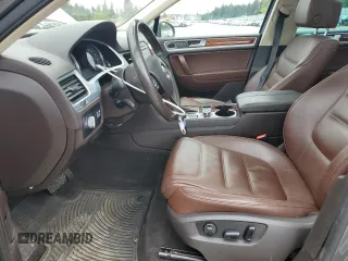2012 Volkswagen Touareg Sport with VIN WVGFK9BP4CD001860, listed as a Copart auction lot 55090375 with 153,456 mi miles and Salvage title. Bid and sale history available at DreamBid. Image 7.