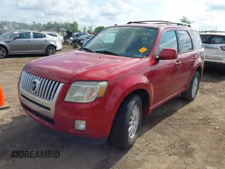 2011 Mercury Mariner Premier z VIN 4M2CN8HG1BKJ06957, wystawiony jako IAAI lot #42455616 z przebiegiem 206 388 mil mil oraz . Historia ofert i sprzedaży dostępna na DreamBid. Obrazek 2.