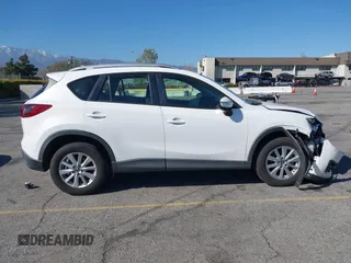 2016 Mazda CX-5 Sport with VIN JM3KE2BY9G0879654, listed as a IAAI auction lot 41819154 with 65,586 mi miles. Bid and sale history available at carsss.com. Image 13.