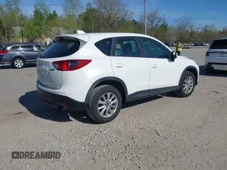 2015 Mazda CX-5 Sport with VIN JM3KE4BY3F0495511, listed as a IAAI auction lot 42170968 with 206,217 mi miles and . Bid and sale history available at carsss.com. Image 4.