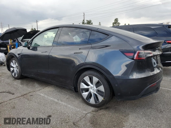 2024 Tesla Model Y with VIN 7SAYGDED1RF052031, listed as a Copart auction lot 48507865 with 5,365 mi miles and Salvage title. Bid and sale history available at DreamBid. Image 2.