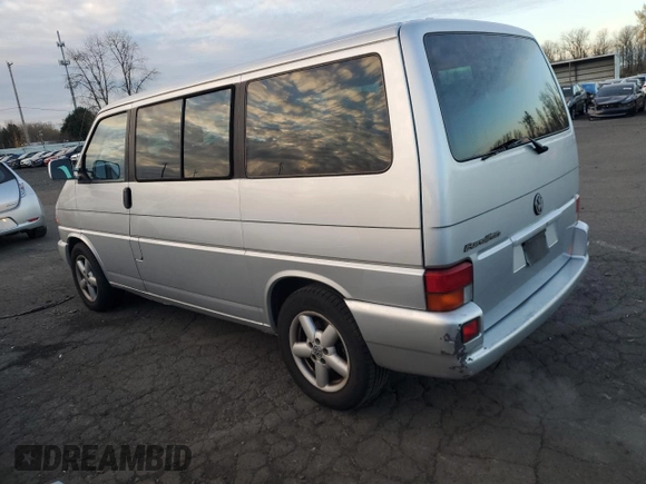2003 Volkswagen EuroVan MV с VIN WV2MB47053H002505, выставлен на аукционе Copart как лот 83840884 с пробегом 250 786 миль миль и Чистый • Clean title. История ставок и продаж доступна на DreamBid. Изображение 2.