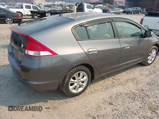 2010 Honda Insight EX with VIN JHMZE2H75AS027964, listed as a IAAI auction lot 41889301 with 136,485 mi miles and . Bid and sale history available at DreamBid. Image 4.