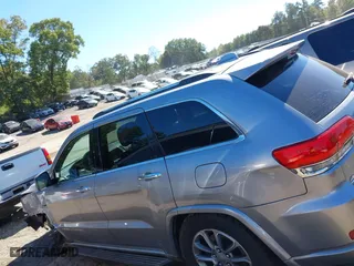 2014 Jeep Grand Cherokee Overland with VIN 1C4RJFCM4EC316142, listed as a IAAI auction lot 40607061 with 195,008 mi miles. Bid and sale history available at carsss.com. Image 13.