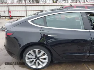 2018 Tesla Model 3 Long Range Battery with VIN 5YJ3E1EB3JF090567, listed as a IAAI auction lot 41568312 with 35,327 mi miles and . Bid and sale history available at DreamBid. Image 21.