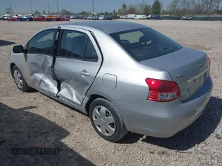 2009 Toyota Yaris with VIN JTDBT903X91301963, listed as a IAAI auction lot 42102283 with 143,966 mi miles. Bid and sale history available at carsss.com. Image 3.