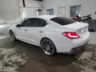 2021 Genesis G70 2.0T with VIN KMTG44LAXMU070314, listed as a Copart auction lot 88990385 with 52,517 mi miles and Salvage Title. Bid and sale history available at DreamBid. Image 2.