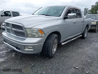 2010 Dodge Ram 1500 SLT with VIN 1D7RB1CT5AS203992, listed as a IAAI auction lot 41931671 with 122,831 mi miles. Bid and sale history available at carsss.com. Image 2.