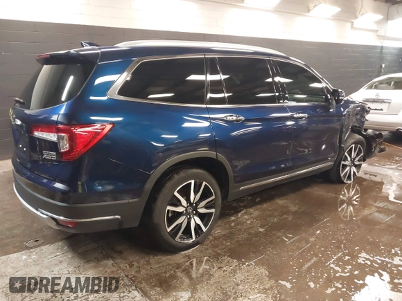 2022 Honda Pilot Touring 7-Passenger with VIN 5FNYF6H65NB052164, listed as a IAAI auction lot 41641601 with 51,700 mi miles. Bid and sale history available at carsss.com. Image 4.
