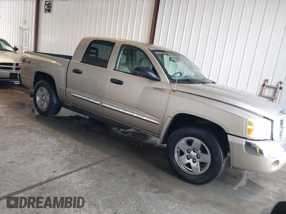 2005 Dodge Dakota Laramie with VIN 1D7HW58N15S159061, listed as a IAAI auction lot 41898306 with 114,288 mi miles and . Bid and sale history available at DreamBid. Image 1.