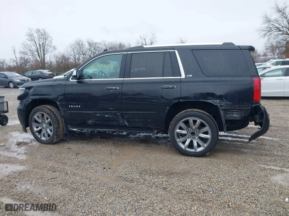 2016 Chevrolet Tahoe LTZ with VIN 1GNSKCKC2GR104305, listed as a IAAI auction lot 41697868 with 124,670 mi miles. Bid and sale history available at carsss.com. Image 14.