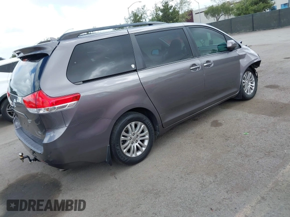 2014 Toyota Sienna XLE with VIN 5TDYK3DC7ES517206, listed as a IAAI auction lot 41945572 with 128,743 mi miles and . Bid and sale history available at DreamBid. Image 4.