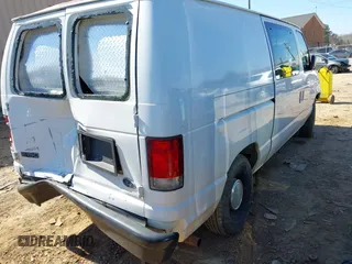 1999 Ford Econoline Cargo with VIN 1FTRE14W0XHB64440, listed as a IAAI auction lot 41645551 with 239,114 mi miles. Bid and sale history available at carsss.com. Image 4.
