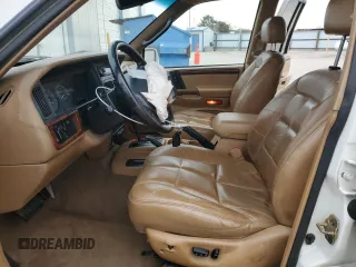 1998 Jeep Grand Cherokee Limited with VIN 1J4GZ78Y5WC259043, listed as a Copart auction lot 43976955 with 212,910 mi miles and Salvage Title. Bid and sale history available at carsss.com. Image 7.