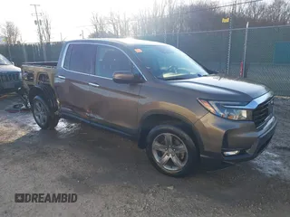 2022 Honda Ridgeline RTL-E z VIN 5FPYK3F79NB005152, wystawiony jako IAAI lot #41754891 z przebiegiem 60 191 mil mil oraz . Historia ofert i sprzedaży dostępna na DreamBid. Obrazek 1.