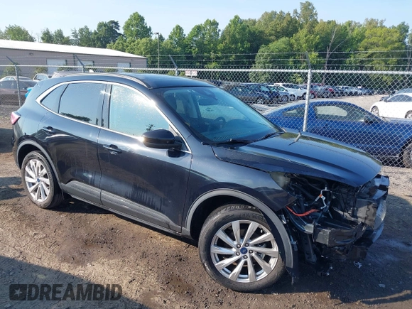 2021 Ford Escape Titanium Hybrid with VIN 1FMCU9DZ0MUB14833, listed as a IAAI auction lot 42593983 with 51,852 mi miles and . Bid and sale history available at DreamBid. Image 1.