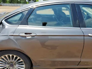 2014 Ford Fusion Titanium Hybrid with VIN 3FA6P0RU2ER158302, listed as a Copart auction lot 59049995 with 108,571 mi miles and Salvage title. Bid and sale history available at DreamBid. Image 10.